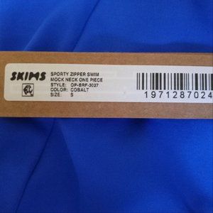 Skims one piece zipper swimsuit